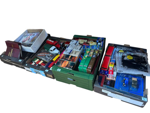 Four boxes of model vehicles, etc.