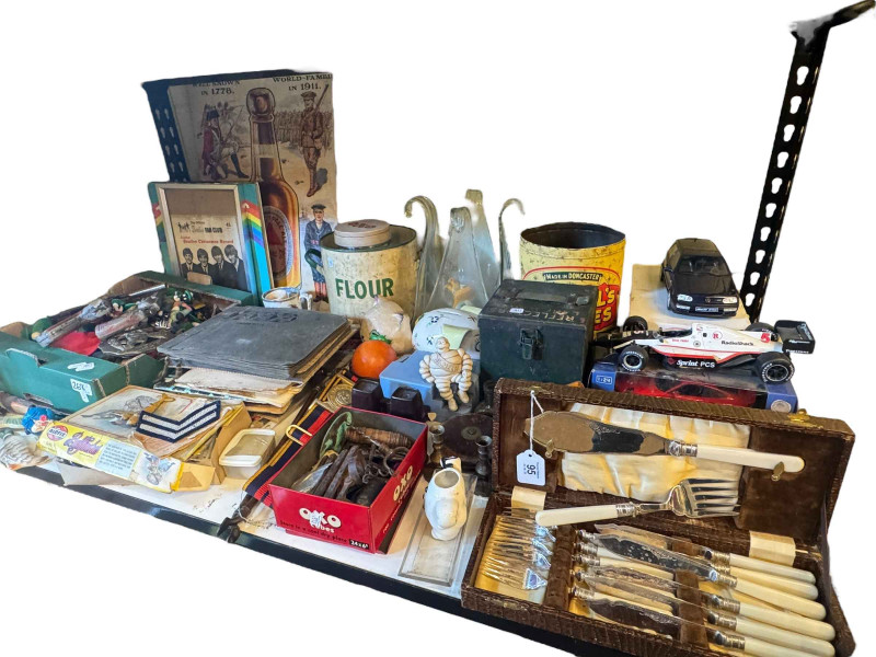 Beatles book and framed record sleeve, model cars, figures and cap guns, corkscrews, albums and miscellaneous.