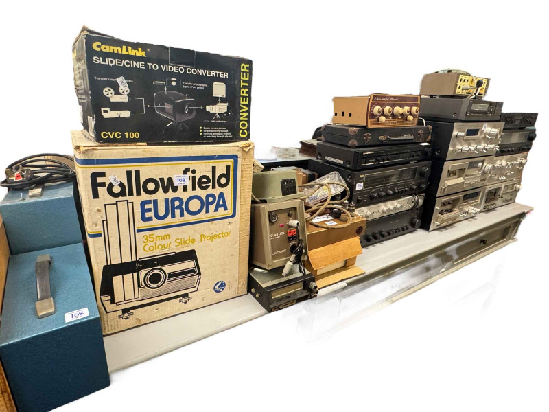 Large collection of audio equipment to include cassette decks, amplifiers, etc, field wireless, projectors, etc. Please note: The lot is sold as seen, no guarantees provided on the conditions with this lot.