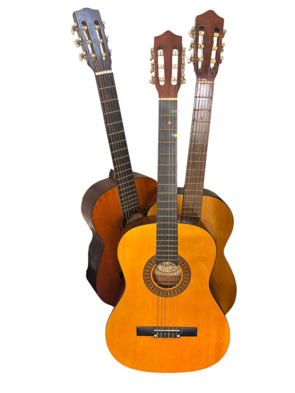 Three acoustic guitars, Hokada, Palma and Otani.