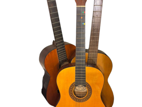 Three acoustic guitars, Hokada, Palma and Otani.