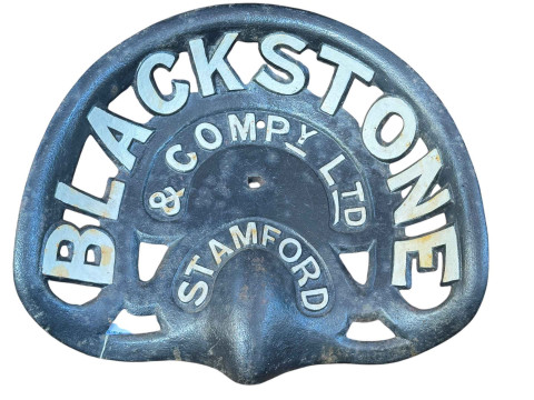 Cast metal tractor seat advertising Blackstone and Company Ltd Stamford.