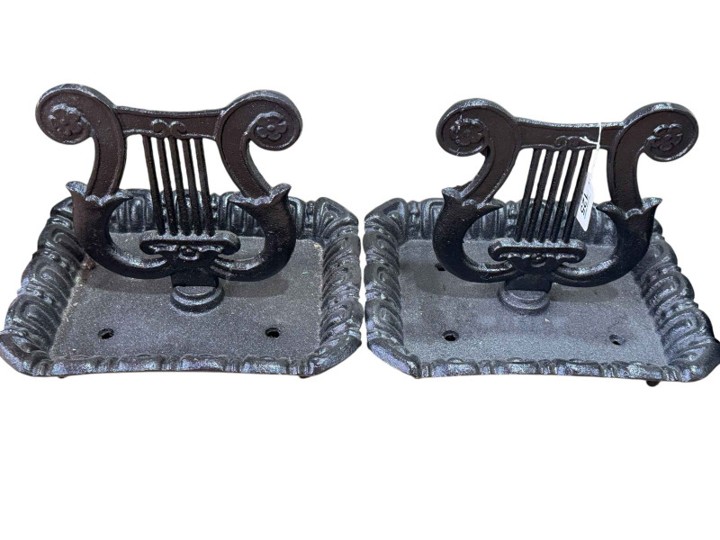 Pair of cast metal boot scrapers.