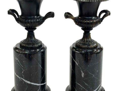 Pair of bronze urns on marble plinths, 31cm high.