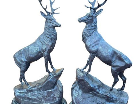 Pair of impressive bronze stags on rocky outcrops raised on marble plinths,...