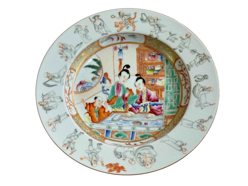 Chinese porcelain plate decorated with figures in a room and figures around the border, 22.5cm diameter.