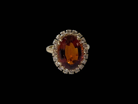 Oval golden citrine and diamond cluster ring set in 18 carat yellow gold,...