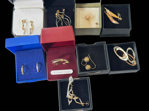 Collection of gold earrings.