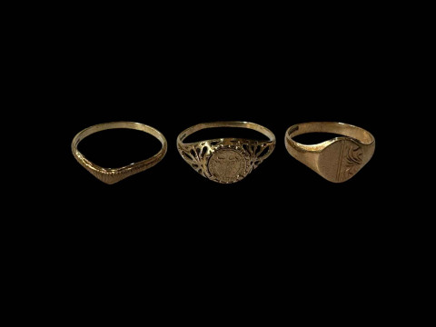 Three 9 carat gold rings.