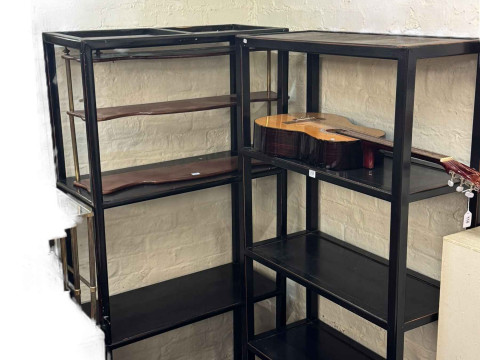 Two black free standing open shelf units, 180cm by 85cm by 38cm.