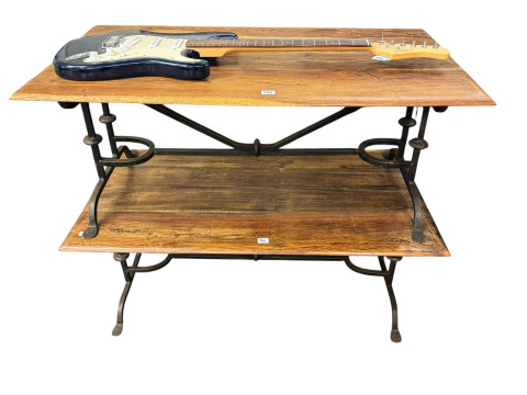 Pair hardwood and wrought iron based low tables, 45cm by 110cm by 61cm.