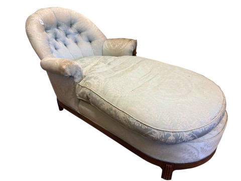 Early 20th Century walnut framed day bed in classical buttoned fabric.