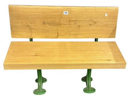 Child's garden bench with cast supports, 55cm by 77cm.