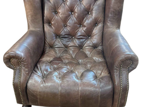 Alexander & James tan buttoned leather and studded wing armchair.
