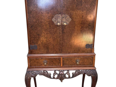 Burr walnut cocktail cabinet having two doors above two drawers on cabriole...
