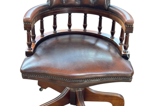 Brown buttoned leather captains style swivel office desk chair.