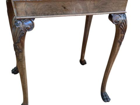 Walnut side table on cabriole legs to paw feet, 78cm by 61cm by 45.5cm.
