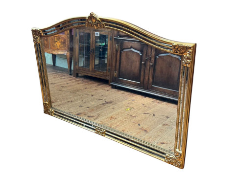 Gilt framed arched top overmantel mirror, 90cm by 128cm.