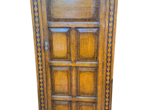 Carved oak hall wardrobe, 181cm by 77cm by 40cm.