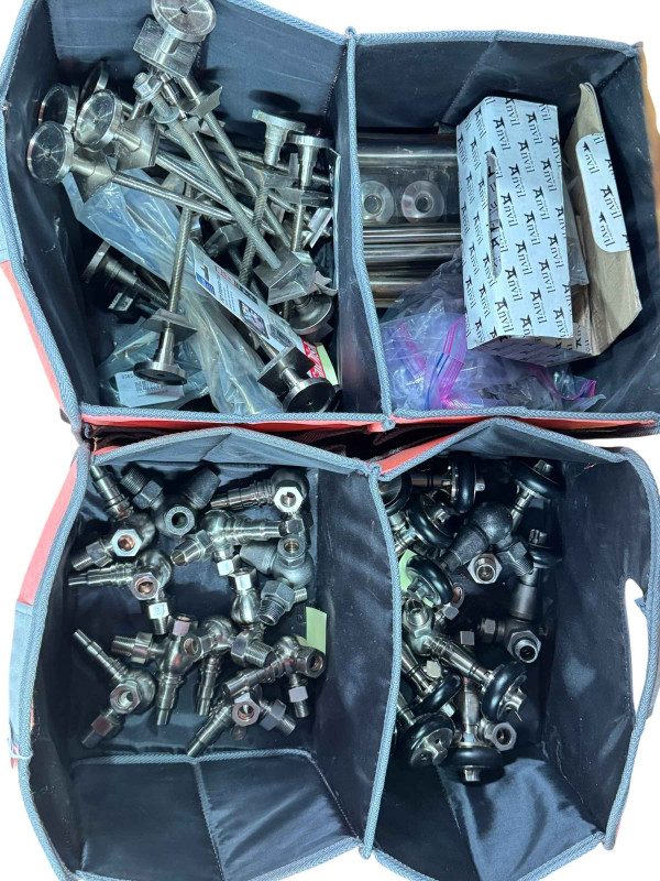Collection of as new cast iron radiator valves, brackets and various fittings.