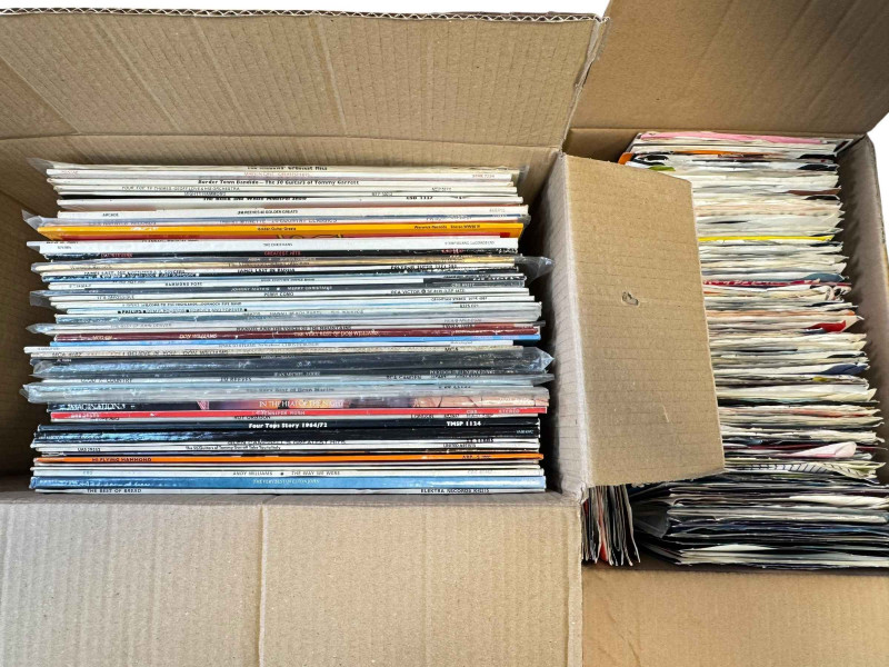 Box of LP records and singles.