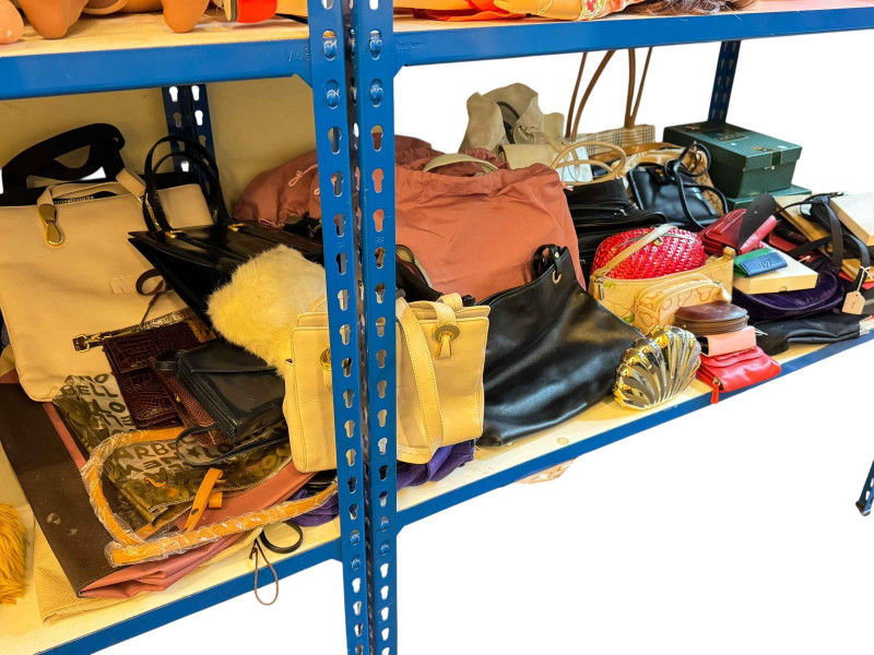 Large collection of handbags and evening bags, many with designer labels including Radley, Gucci, etc.
