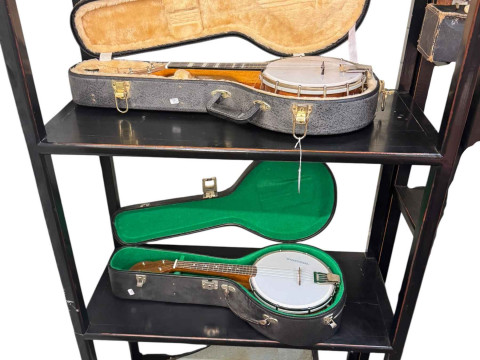Collection of banjos in cases, violin with bow in case, etc.