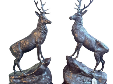 Pair of impressive bronze stags on rocky outcrops raised on marble plinths,...