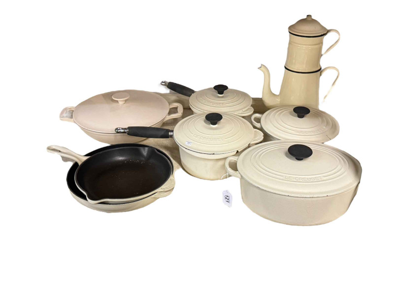 Collection of Le Creuset pans.
