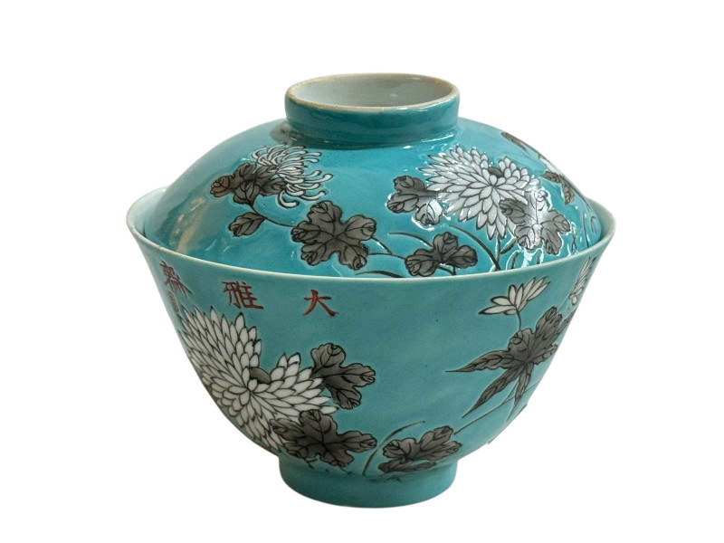 Chinese turquoise tea bowl and lid with floral design, iron red four character mark to base.