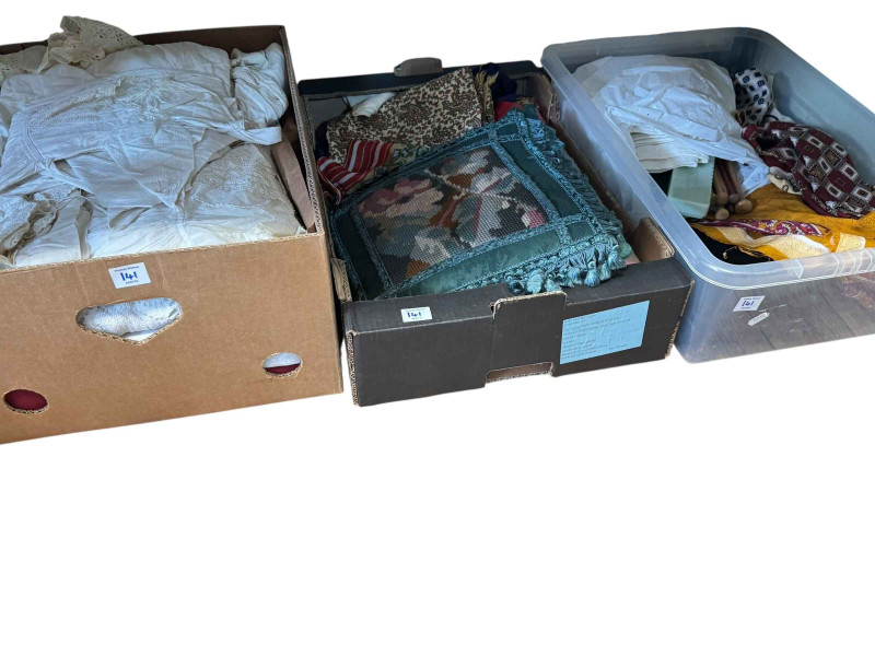 Five boxes of linens, fabrics, etc.