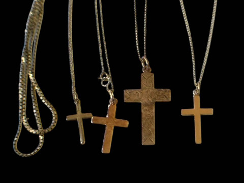 Collection of four gold chains and gold crosses, 9 carat and one chain...