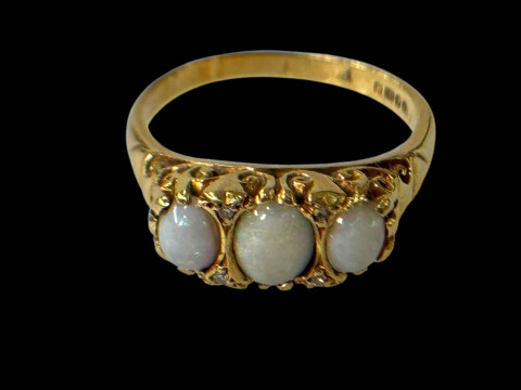 Opal three stone 18 carat gold ring, size P.