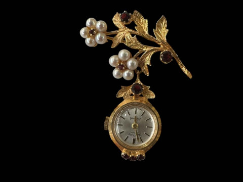 9 carat gold, garnet and pearl brooch with Rotary pendant watch.