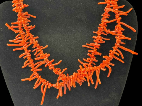 Pair of graduated coral necklaces with silver clasps.