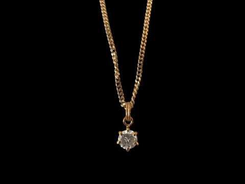 Diamond pendant with 18 carat gold chain.