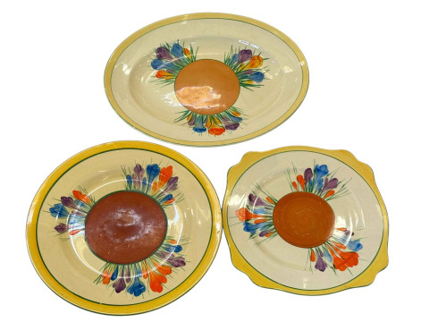 Three Clarice Cliff Crocus pattern plates including large oval and Leda...