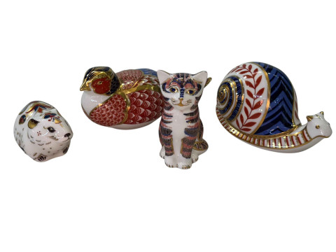 Four Royal Crown Derby paperweights.