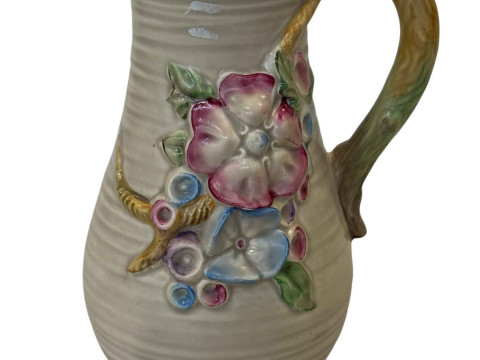 Clarice Cliff flower moulded jug, 20.5cm.