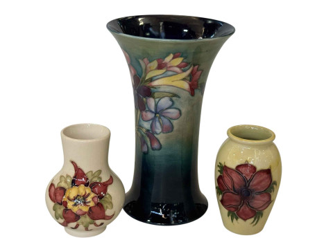 Three Moorcroft pottery vases, largest 20cm.