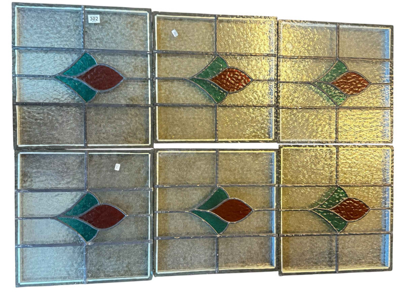 Near set of six coloured leaded windows.