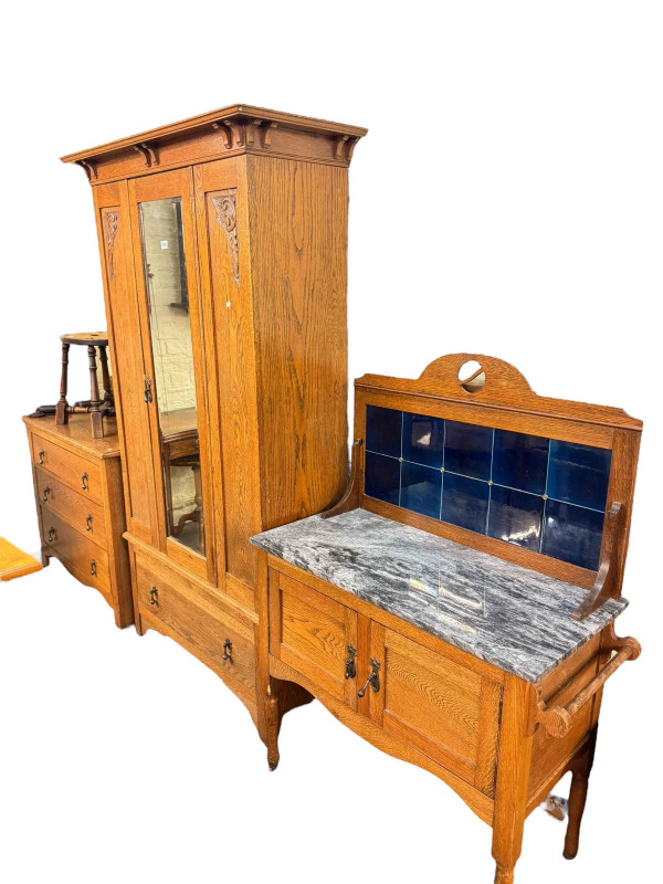 Early 20th Century three piece oak washstand bedroom suite together with a later headboard (4).