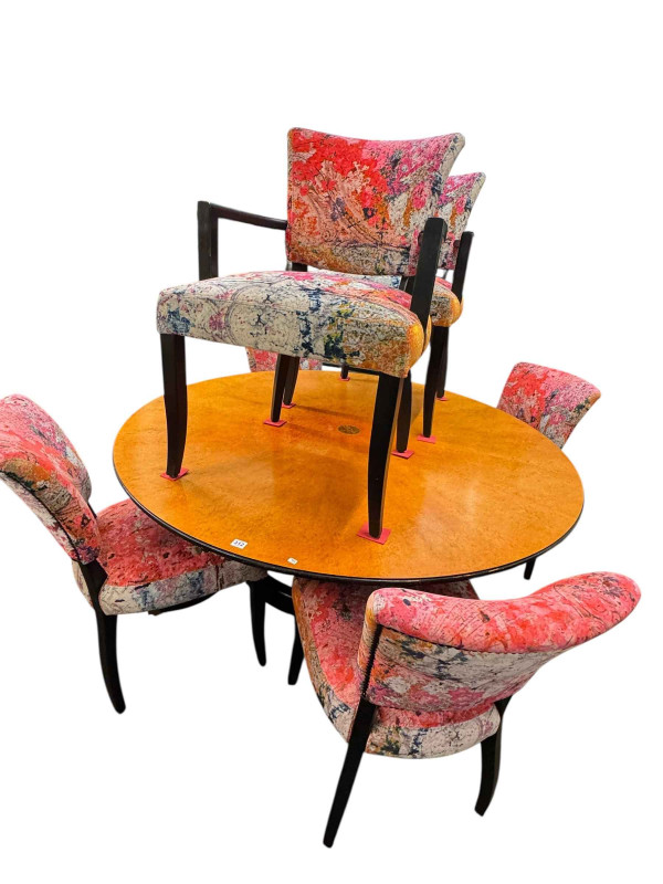 Large burr walnut and ebonised circular extending dining table and five leaves, 214cm diameter including leaves, and set of six dining chairs including pair carvers.