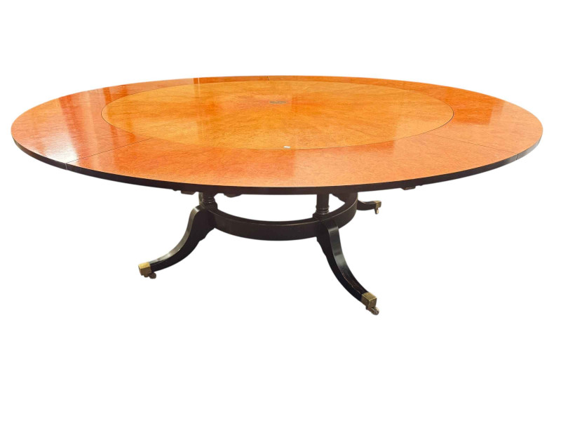 Large burr walnut and ebonised circular extending dining table and five leaves, 214cm diameter including leaves, and set of six dining chairs including pair carvers.