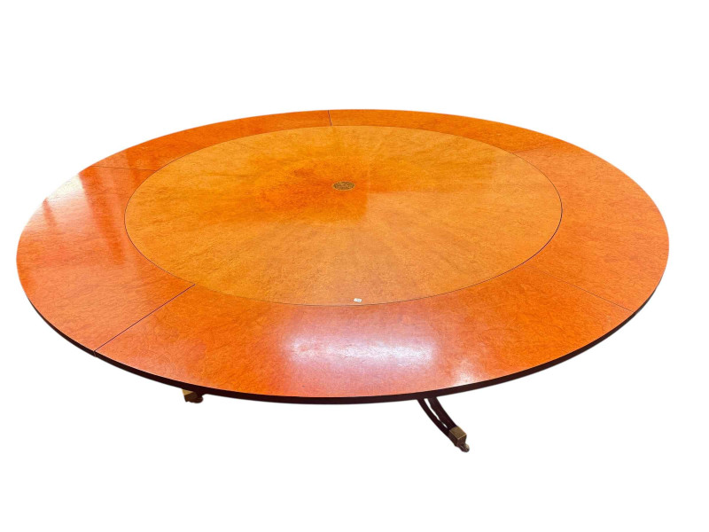 Large burr walnut and ebonised circular extending dining table and five leaves, 214cm diameter including leaves, and set of six dining chairs including pair carvers.