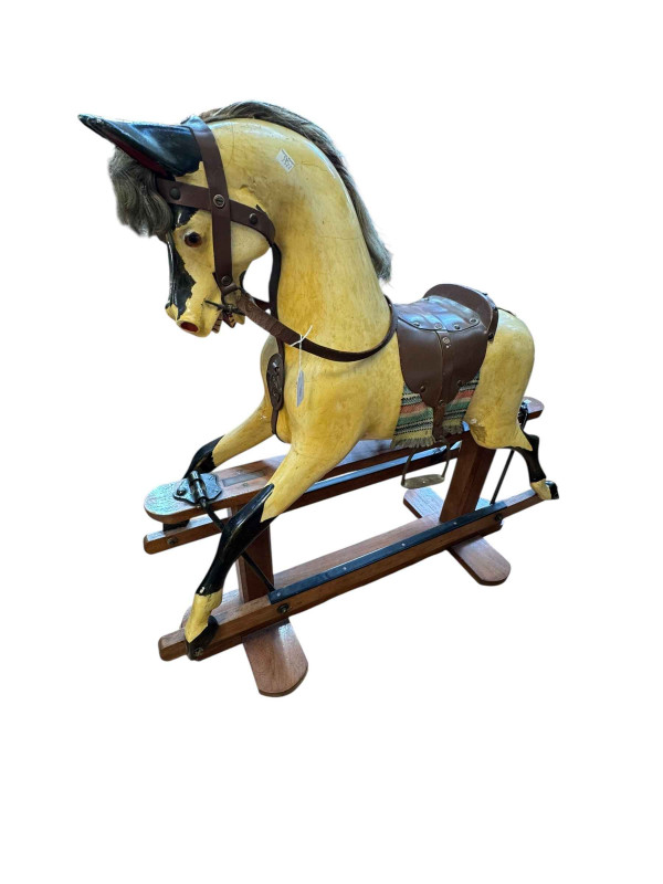 WITHDRAWN   Painted rocking horse with leather saddle on safety stand, 97cm by 101cm by 34cm.