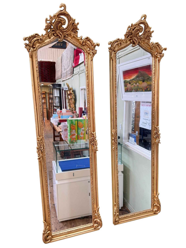 Pair rectangular arched top gilt framed bevelled wall mirrors, 175cm by 54cm.