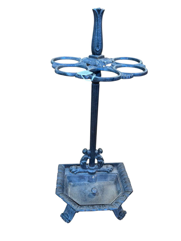 Cast iron five division stick stand, 85cm by 38cm by 29cm.