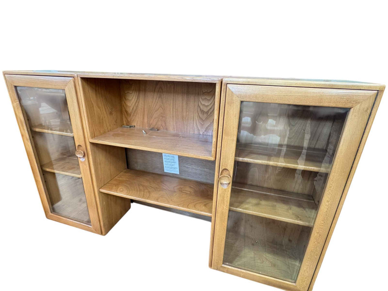 Ercol Windsor display having central open shelves flanked by two glazed door cabinets, 94cm by 155cm by 28cm.