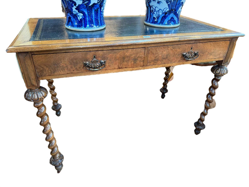 19th Century walnut two drawer writing table on twist legs, 73.5cm by 107cm by 60.5cm.